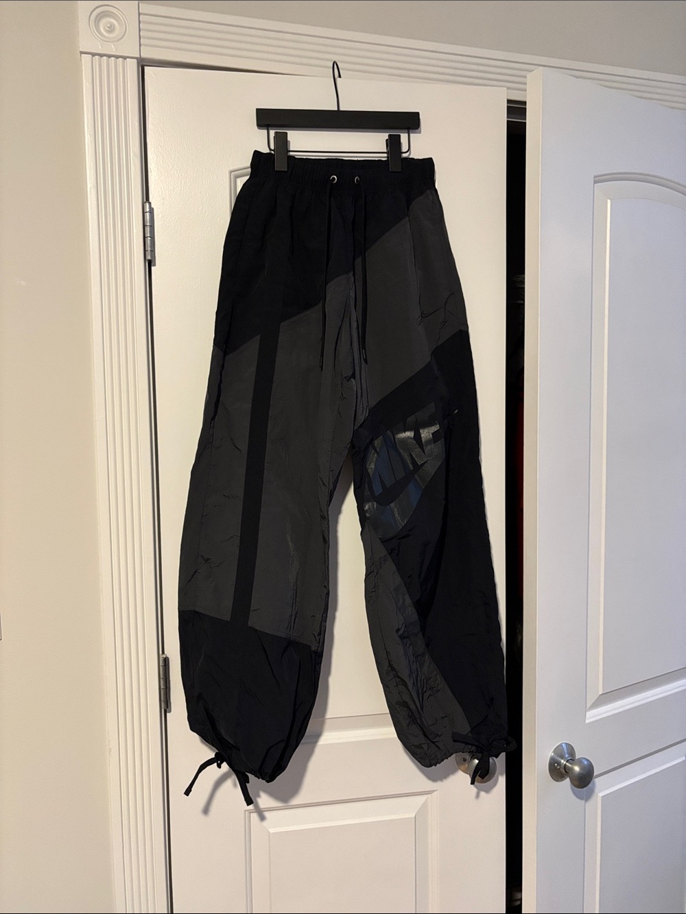 Nike Women’s Black & Charcoal Paneled Nylon Track Pants